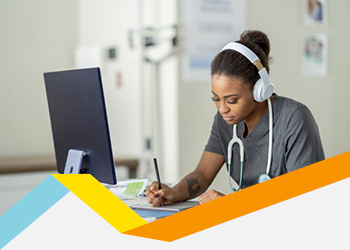Young woman wearing headphones in front of a monitor